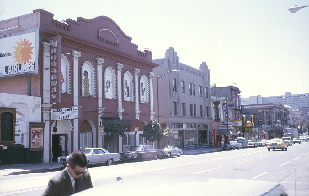 The On Broadway Theatre in 1969, painted red, with Oscar Brown Jr.'s Joy '69 on the marquee